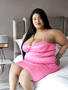 Brunette Bbw Amanda Rousel Showing Off Her Body In A Pink Dress