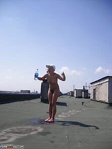 Two Gals Sunbathing Nude At Roof